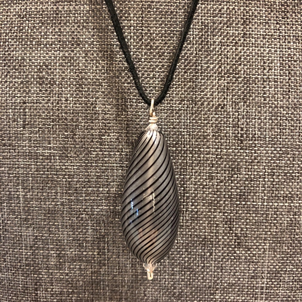 Hand blown glass bead pendant.